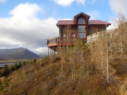 a house on the top of a hill at Family Home in Fáskrúðsfjörður