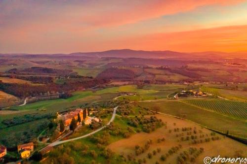 a painting of a golf course at sunset at Mancino in Poggibonsi