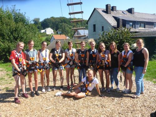 a group of girls posing for a picture with their medals at Appartementhaus EifelAdventures in Berlingen