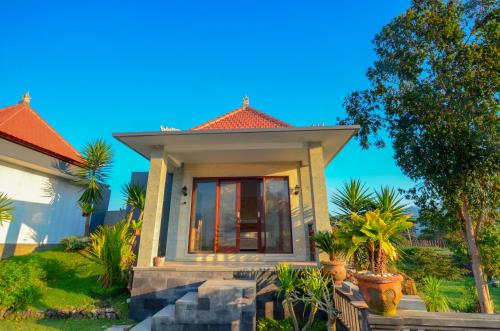 a small house with an orange roof at Villa Danu Kintamani in Kintamani