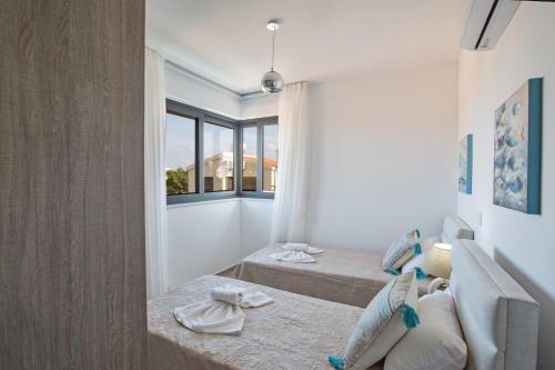 Llit o llits en una habitació de Colour Residences
