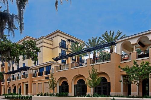 a large building with palm trees in front of it at The Alfond Inn in Orlando