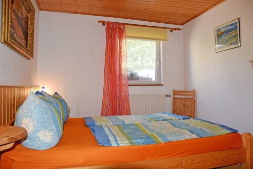 En eller flere senge i et værelse på Ferienhaus Familie Teetz