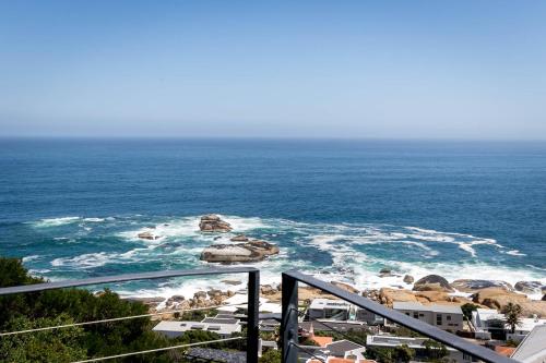 a view of the ocean from a balcony at The Gekko Lodge in Cape Town