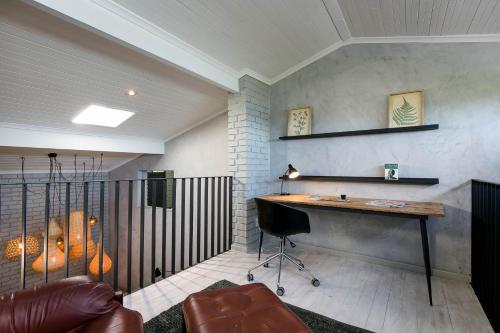 a home office with a desk and a chair at The Gekko Lodge in Cape Town