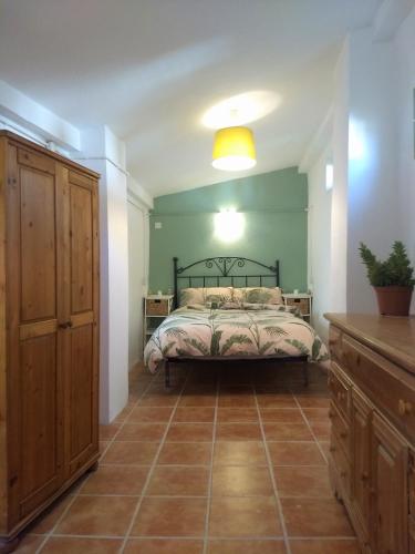 a bedroom with a bed in a room at Casa Libertad in Órgiva