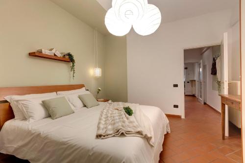 Un ou plusieurs lits dans un hébergement de l'établissement Mamo Florence - Ghibellina Apartment