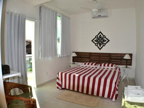 Tempat tidur dalam kamar di Pousada da Gigoia - Barra da Tijuca