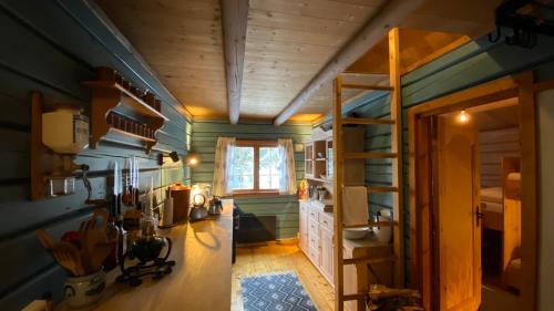 a room with blue walls and wooden ceilings at Bjerkely, Sjusjøen in Sjusjøen