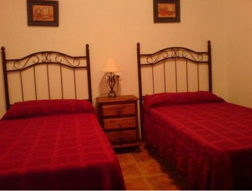 Cama o camas de una habitación en Casa Jazmín