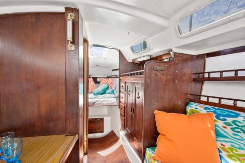 an interior view of a boat with a bed and a table at Blue Oasis in Downtown St Augustine in Saint Augustine