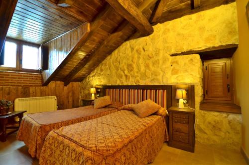 מיטה או מיטות בחדר ב-Senda Del Alba