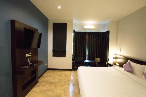 Aziss Boutique Hotel - SHA Plusにあるベッド