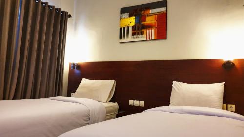 Posteľ alebo postele v izbe v ubytovaní Tara Bali Residence