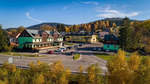 a small town in the mountains with a street at Hotel Prichovice in Kořenov