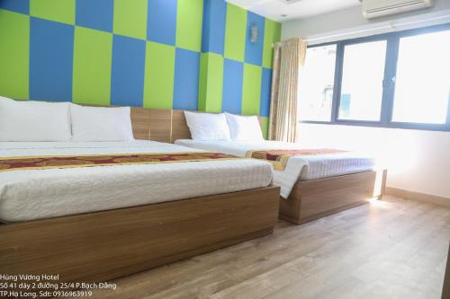 Hùng Vương Hotel Hạ Longにあるベッド