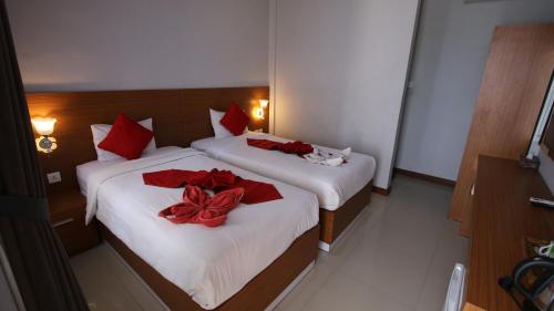 Letto o letti in una camera di Tom Guest House