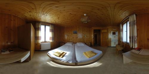 Cama o camas de una habitación en Hôtel de Torgon
