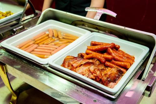 a tray of food with french fries and meat at Hotel Academic in Zvolen