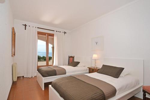 Postel nebo postele na pokoji v ubytování Villa Marinero - Can Torrens