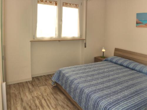 リニャーノ・サッビアドーロにあるAlidecoのベッドルーム(ベッド1台、窓付)