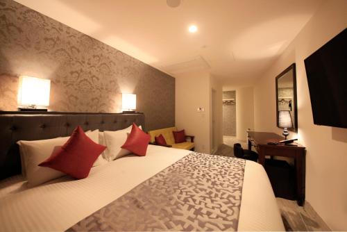 Cama o camas de una habitación en Centurion Hotel Ueno