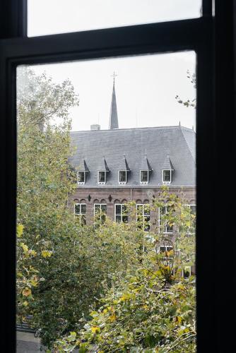 a view of a large building from a window at The Hunfeld in Utrecht