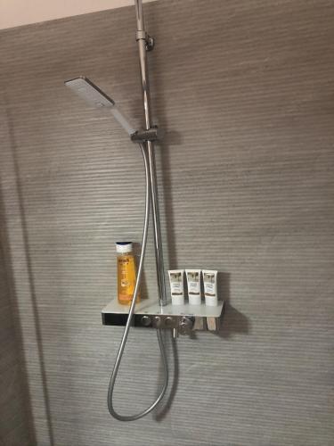 a shower with a shower head in a bathroom at Vista Baglio Grande in Sambuca di Sicilia