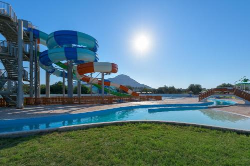 a large water park with a water slide at Olive Garden Hotel in Lardos
