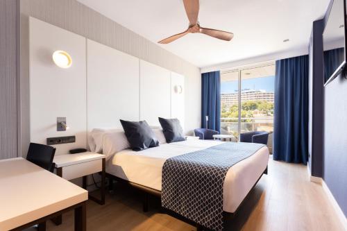 a hotel room with a bed and a window at Catalonia Majórica in Palma de Mallorca
