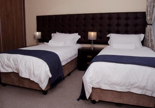 Кровать или кровати в номере Durban Suites at Oceanic