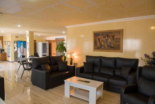 
a living room filled with furniture and a couch at Hotel Sierra Mar in La Unión
