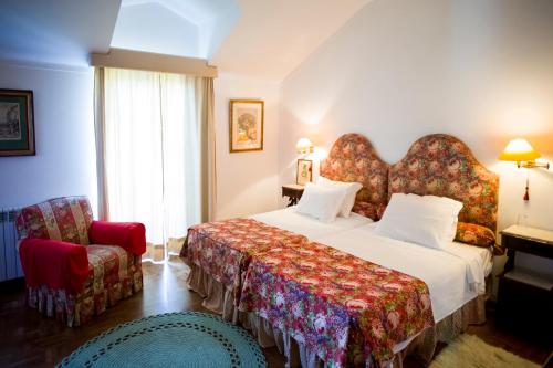 A bed or beds in a room at Casa do Castelo - Turismo de Habitação