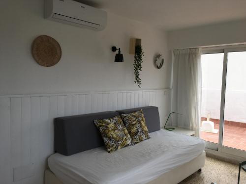 A bed or beds in a room at Apartamentos Villa Nadine