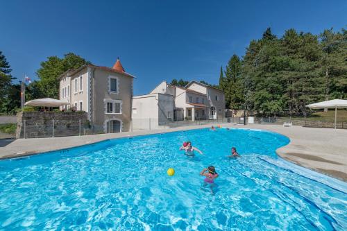 a group of people swimming in a swimming pool at Chateau de Collonges in Saint-Donat-sur-lʼHerbasse