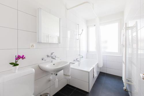 Ванна кімната в Apartmenthaus zum Trillen Basel City Center