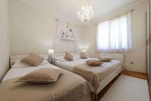 Llit o llits en una habitació de Villa Bella