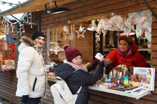 a group of people standing in front of a store at Bukovel Apart in Bukovel