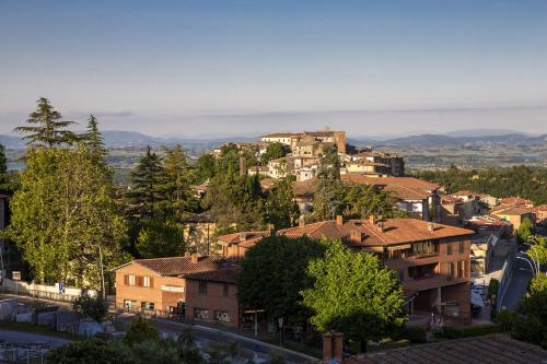 a view of a town with houses and trees at Santa Caterina Hotel & Bike in Chianciano Terme