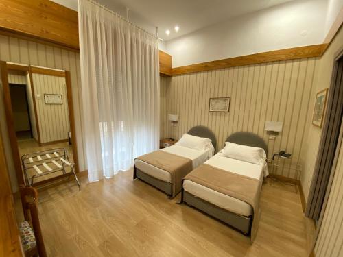 Postel nebo postele na pokoji v ubytování Hotel Cicolella