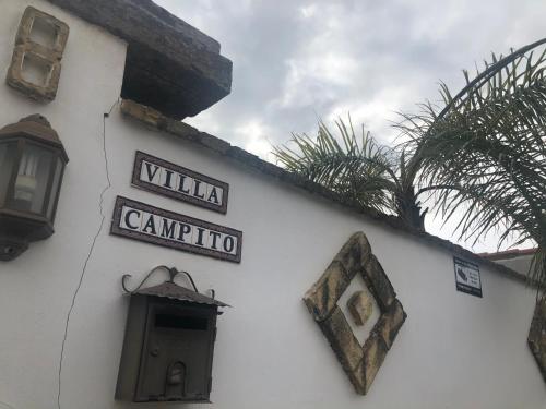 a building with signs on the side of it at Villa Campito in El Puerto de Santa María