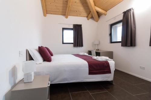 Postel nebo postele na pokoji v ubytování Hotel Cascina Fossata & Residence