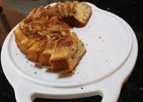 a white plate with a piece of bread on it at Pousada Canto Verde in Boicucanga