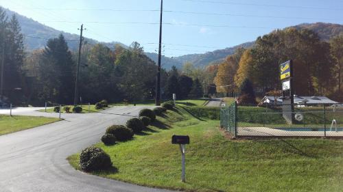 a street with a sign on the side of a road at Scottish Inn Maggie Valley in Maggie Valley