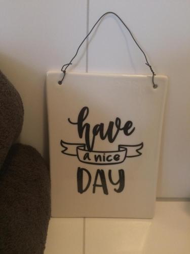 a sign that says have a nice day at Slapen bij Van-V in Zierikzee