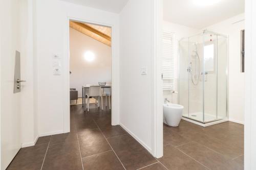 a bathroom with a shower and a toilet at Hotel Cascina Fossata & Residence in Turin