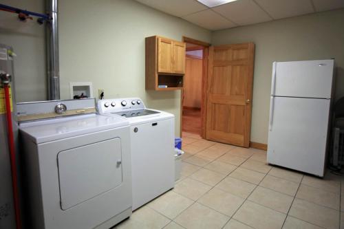a kitchen with a white stove and a refrigerator at Marina Vista in Penn Yan