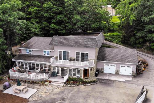 an aerial view of a white house with a porch at Marina Vista in Penn Yan