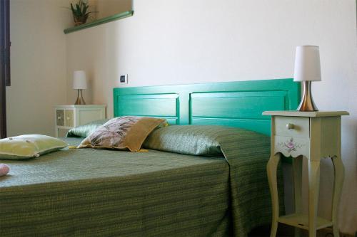 Postel nebo postele na pokoji v ubytování B&B S'ARROSA ANTIGA