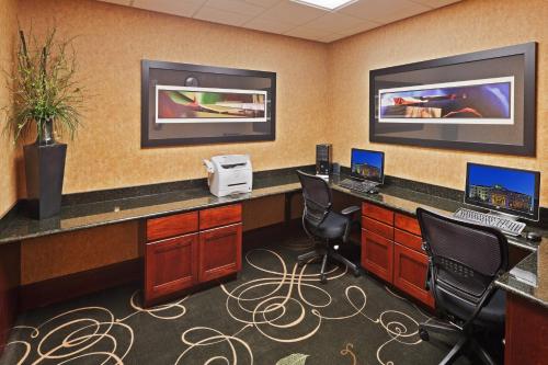 an office with a desk with two computers and chairs at Holiday Inn Express & Suites Poteau by IHG in Poteau